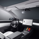 A render of the interior of a Tesla Model Y.